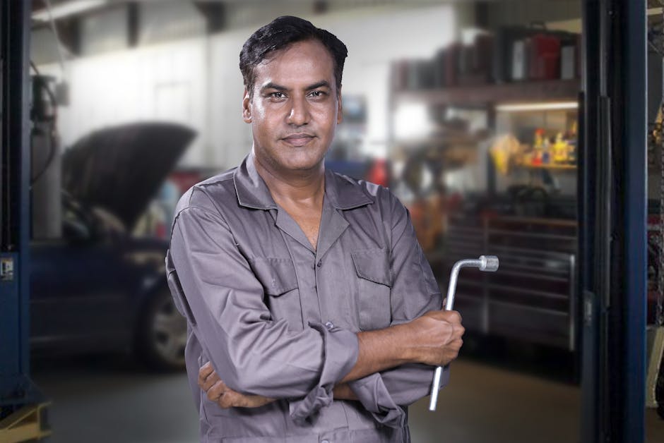 Smiling auto mechanic professional