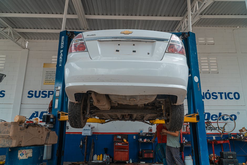 Car on a hydraulic lift for wheel alignment